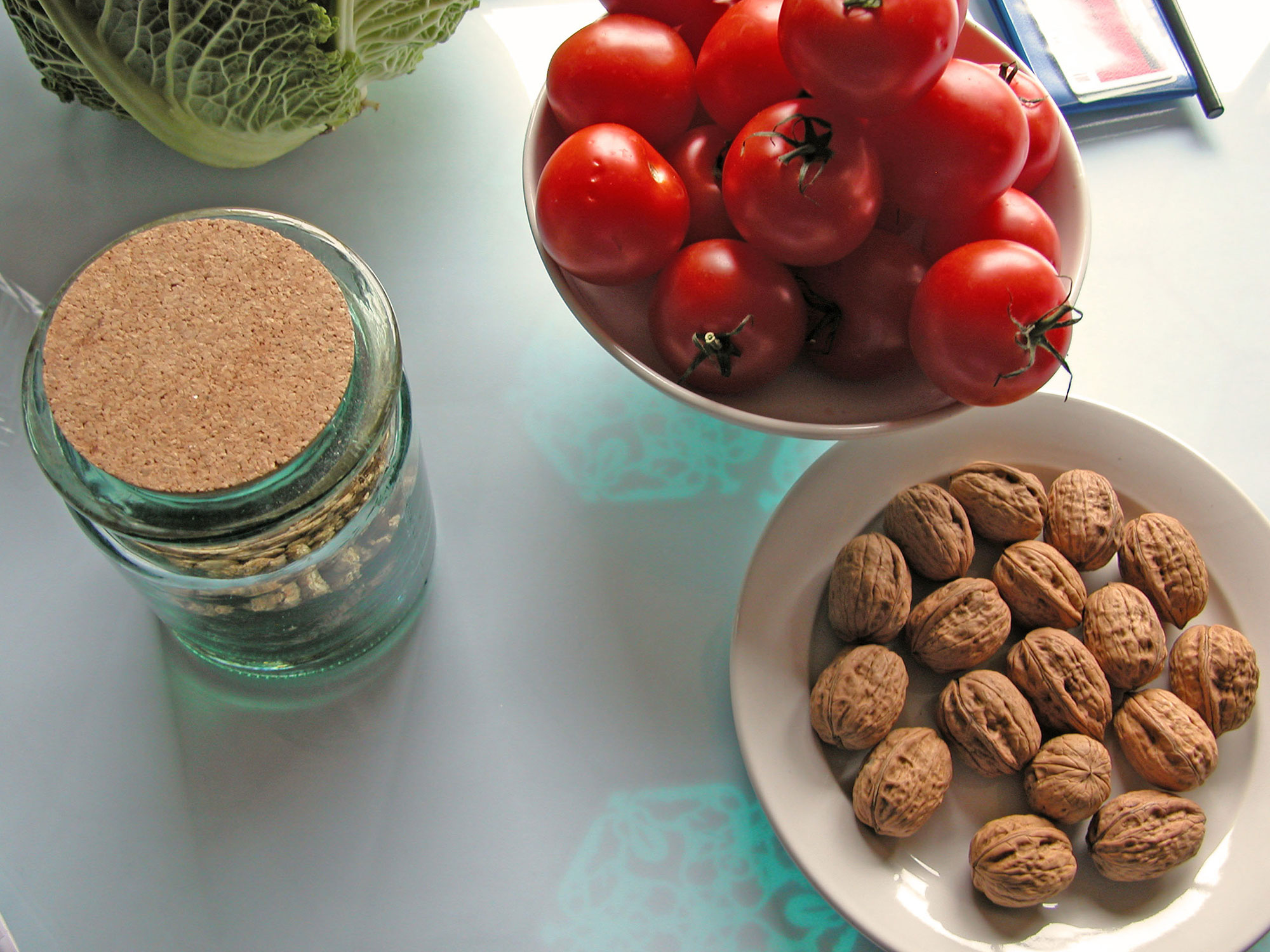 A photograph of bowls, plates and jars on the History Tablecloth in the home of a participant
